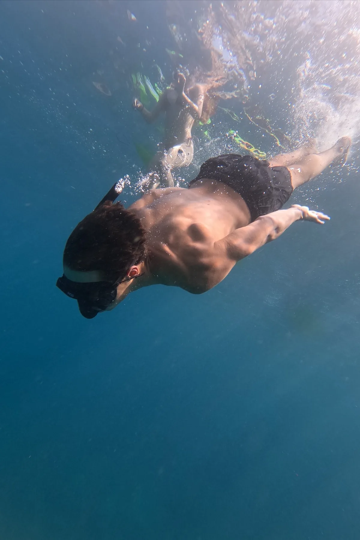 Person snorkelling underwater in Palm-Mar